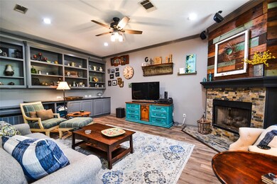 Additional view of living room with fireplace, boo