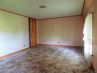 One of two upstairs bedrooms. This bed room measures 15 x 11