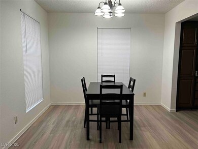 Dining space featuring wood finished floors, a cha