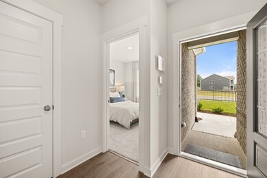 A spacious entry awaits you in this beautiful new home. Photo of decorated model home of this floorplan, not actual home listed.