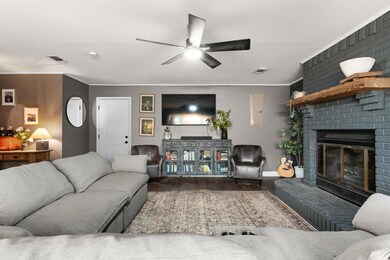 Living room featuring wood finished floors, visib