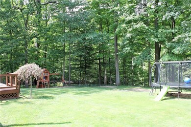Additional view from other corner of yard. Trampoline and Playset do not stay.