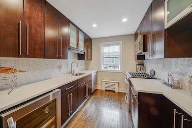 Kitchen featuring hardwood / wood-style floors, li