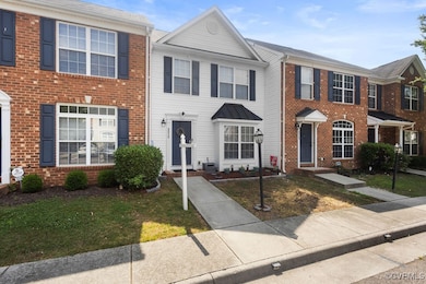 Townhome / multi-family property with brick siding