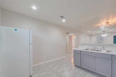 Freshly updated space with neutral tones, recessed