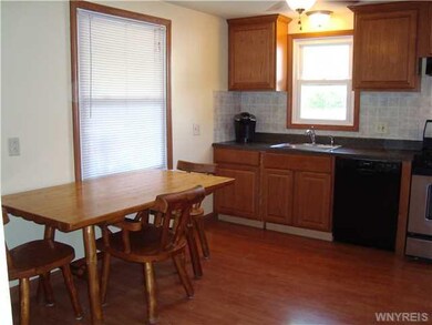 Kitchen Dining. Kitchen has wood laminate floor.  