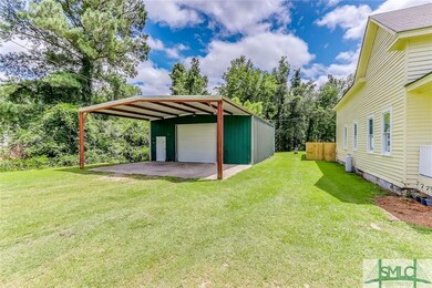 Large carport and metal workshop