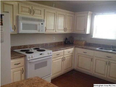 Glazed cabinets with new counter tops.  Very open 