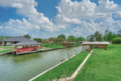 The boat house has recently been given a new roof! You will find a boat lift and a jet ski lift.