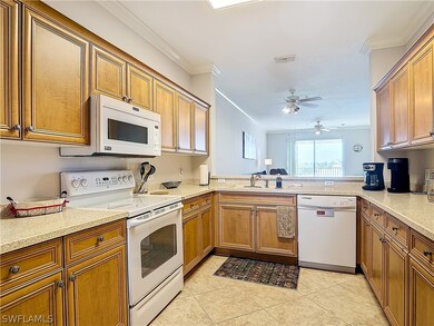 Kitchen with white appliances, kitchen peninsula,