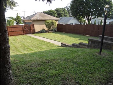 A fenced yard, 2 car garage, and off street parkin