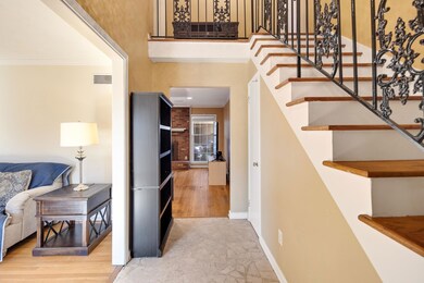 Interior space featuring crown molding and a tower