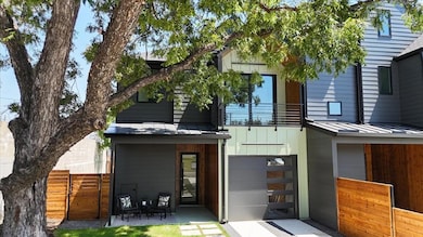 Rear view of property with a standing seam roof, 