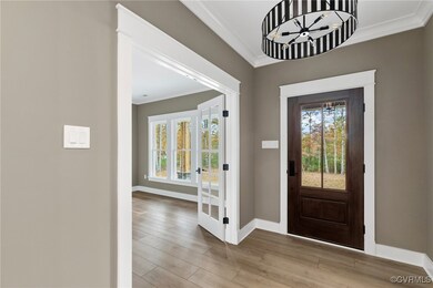 Entrance foyer featuring french doors, ornamental