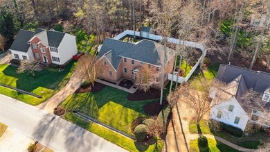 The backyard is fenced with a vinyl privacy fence.