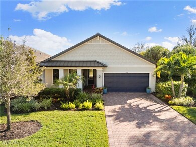 View of front of property with stucco siding, decorative driveway, a standing seam roof, a garage, and a metal roof