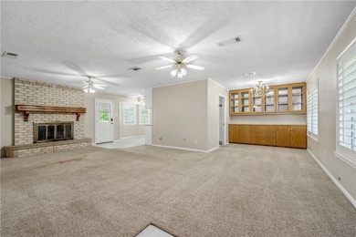 Unfurnished living room with ceiling fan, baseboar