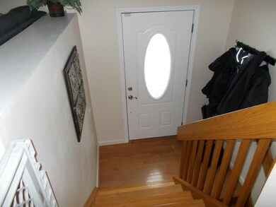 Welcoming front door entry- stairway leads you up 