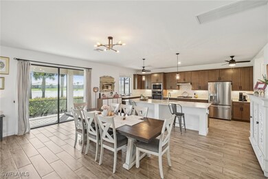 Dining space with visible vents, ceiling fan with