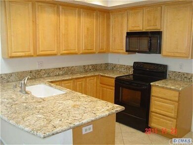 Kitchen features black appliances