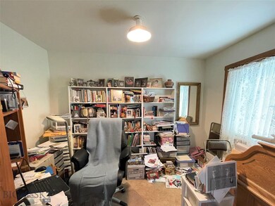 One of the upstairs bedrooms, currently being used