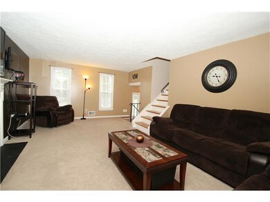 Formal living room with wood burning fireplace.