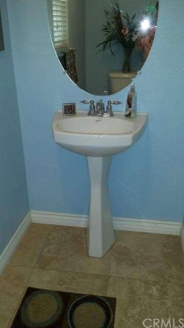 Downstairs guest powder room.