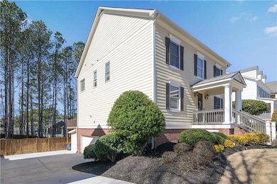 View of property exterior featuring driveway, cove