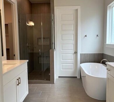 Bathroom with vanity, a shower stall, and a frees