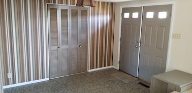 Spacious front entry foyer with large closet.