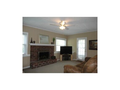 Family Room w/Fireplace and Access to the Deck