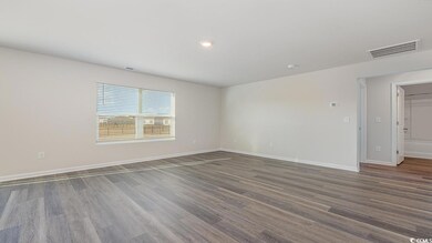 Spare room featuring dark wood-type flooring