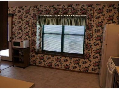 Kitchen. Kitchen has a Pantry, Electric Stove, Dishwasher, Microwave Oven & Stand & Window Seat