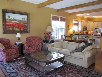 Very comfortable family room has cedar beams and o