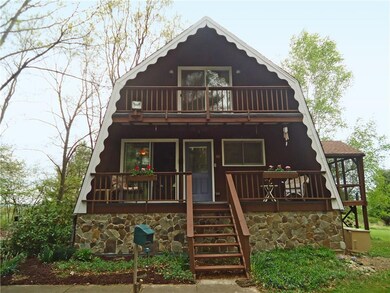 Main entry with spacious deck into second level li