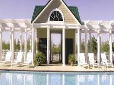 Exterior space with a pergola and an outbuilding