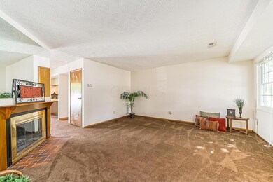 Great Room - Log Wood Burning Fireplace