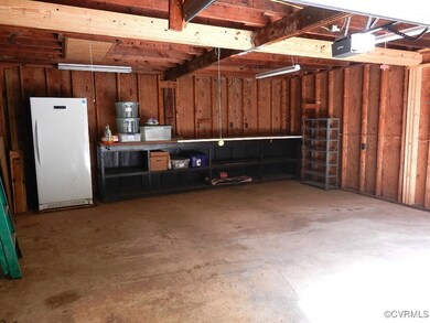 Clean 2 Story Garage with Bench & Freezer Conveys