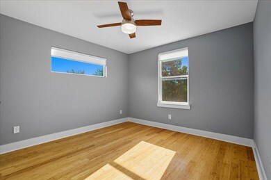 Spare room featuring light wood finished floors and a ceiling fan