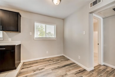 Unfurnished dining area with baseboards, visible v