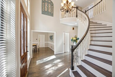 Enter this stunning home through a soaring foyer w