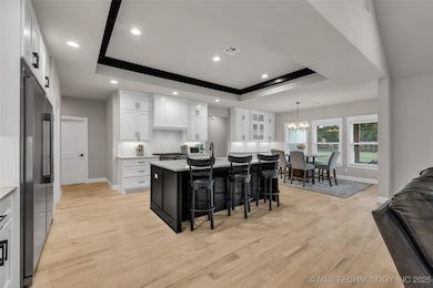 Kitchen with dining over- looking backyard