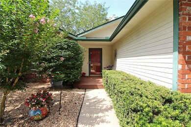 Entrance way has beautiful shrubs and quaint raised porch. A great place for a bistro table or decor of your choice! Immaculate inside and out!