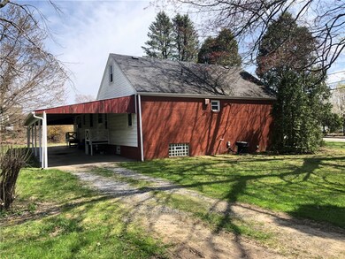 Side yard, covered parking for 2-3 vehicles & acce