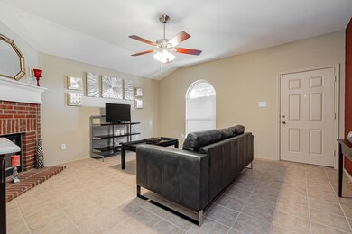 Living room featuring ceiling fan, lofted ceiling,