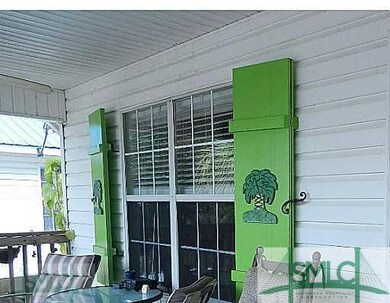 Porch. Custom made storm shutters, charming and fu