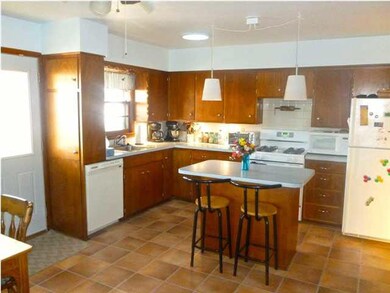 Kitchen includes range refrigerator and dishwasher