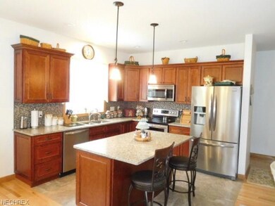 Cherry cabinets, quartz countertops, kitchen flows