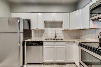 Granite countertops and ample cabinet storage