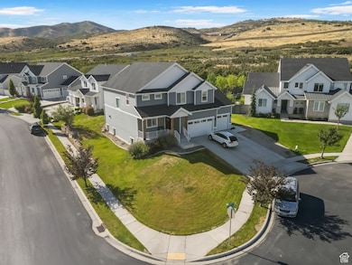 Aerial view of residential area featuring a mountain backdrop